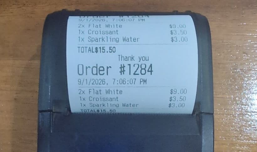 A printed receipt showing TOTAL and the amount jammed together with no space